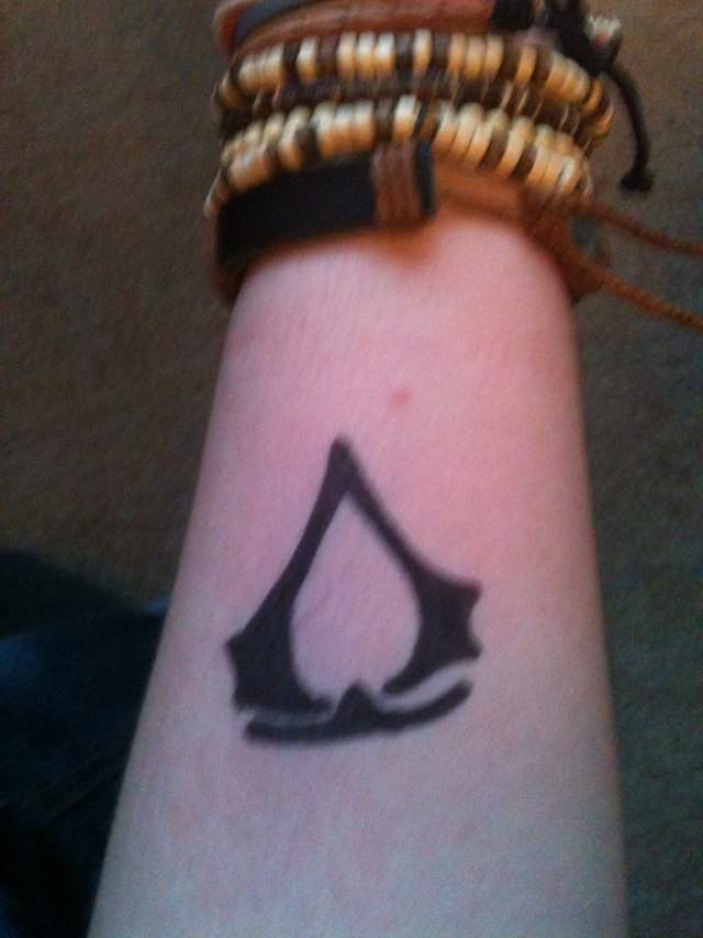 Tattoo uploaded by Jay Red  My first tattoo Assassins creed logo with my  own insignia on the inner section I want this tattoo to connect with other  tribal based tattoos on